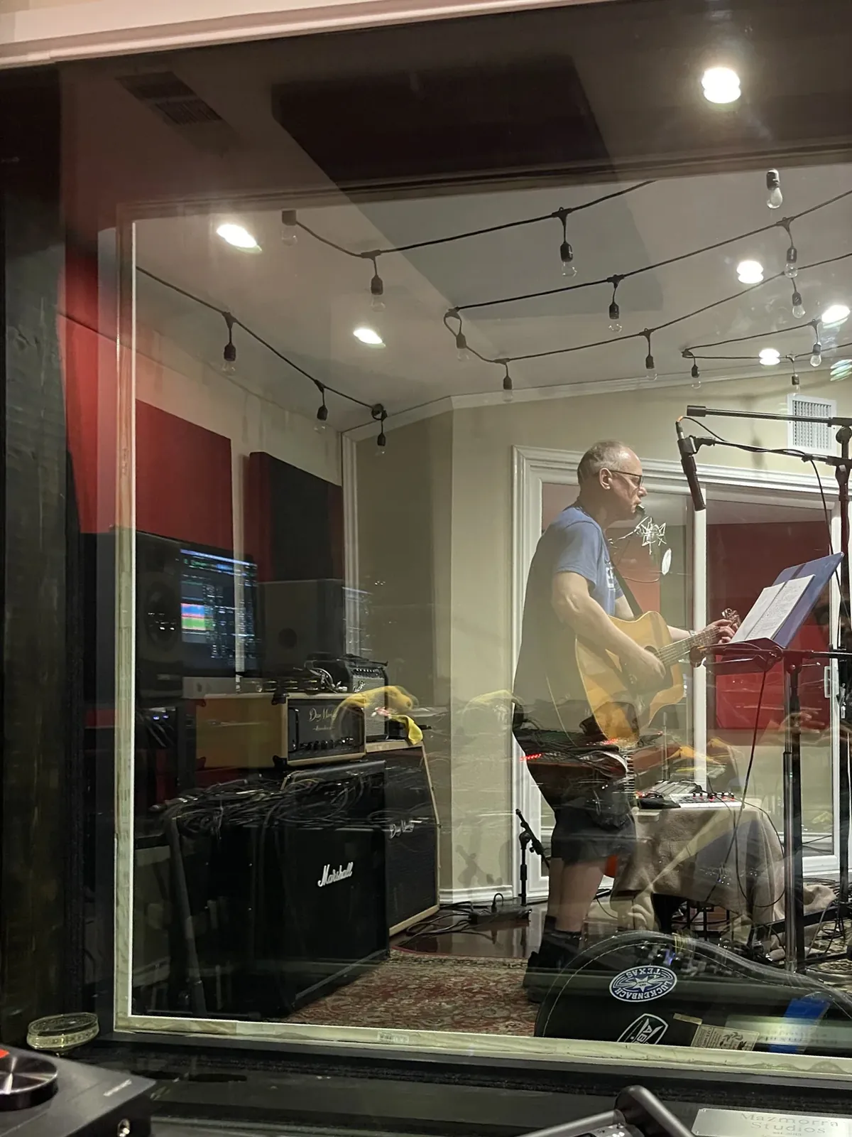 Singer tracking vocals at MidWav Studio